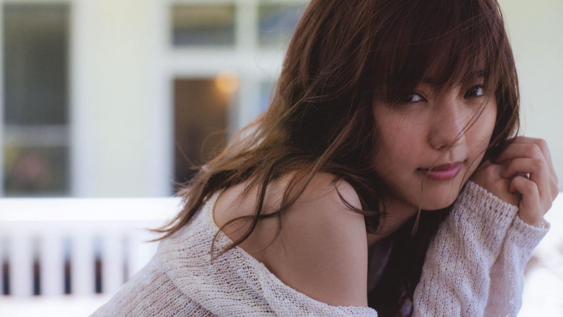 Appealing brown-haired Asian woman in casual outdoor setting, perfect for your phone or desktop wallpaper.
