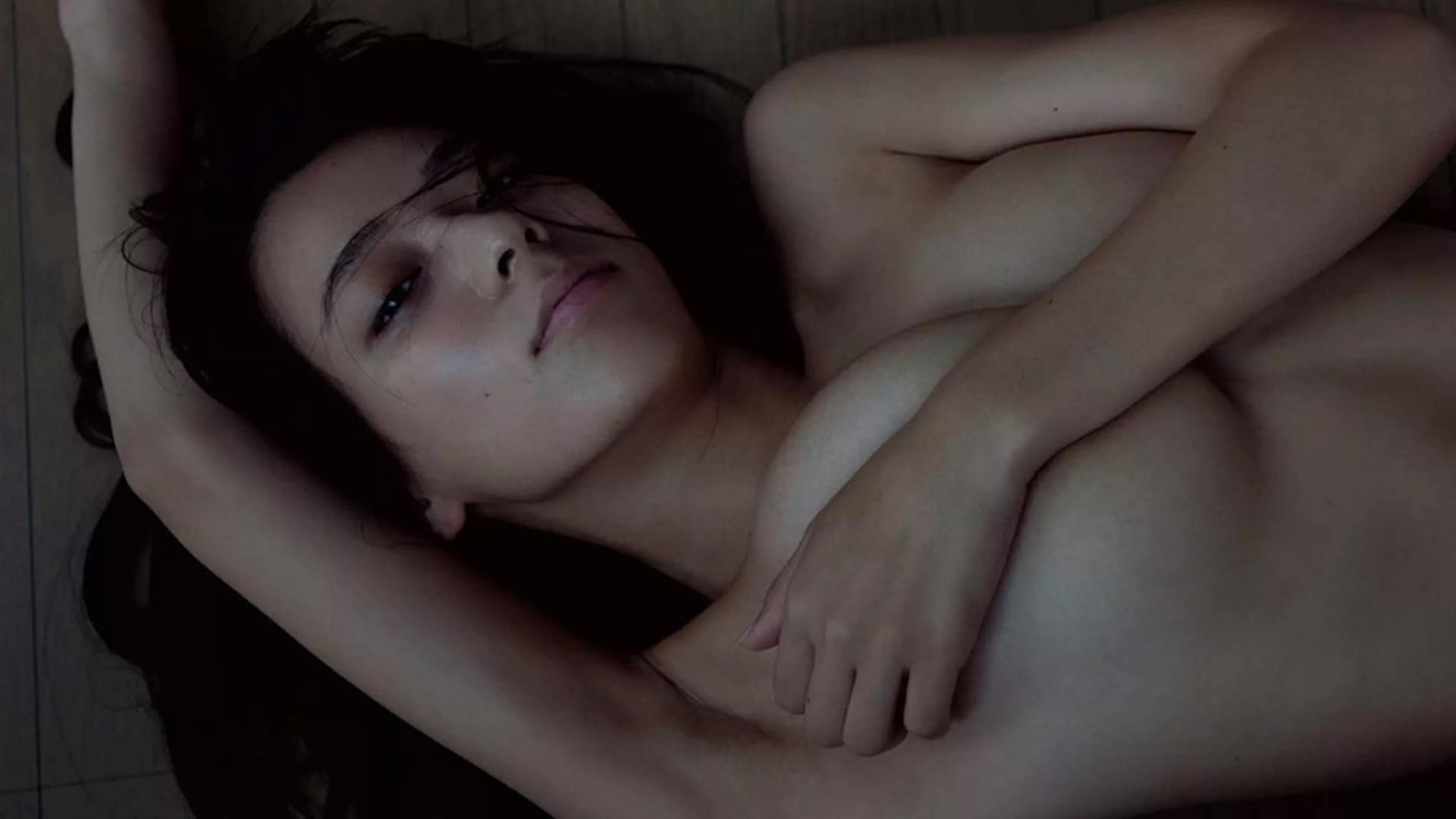 Alluring Asian brunette on floor, natural beauty.